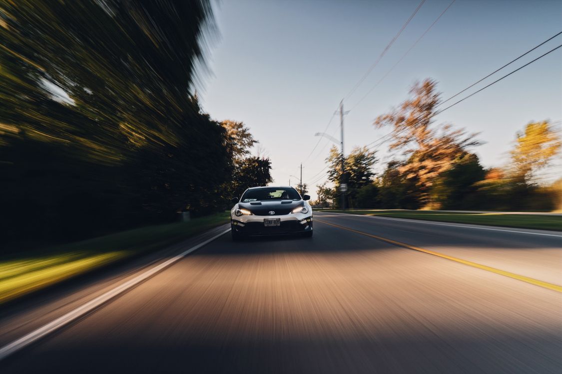 white car on road during daytime