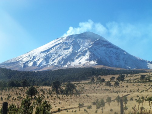 Image white and black mountain under blue sky during daytime