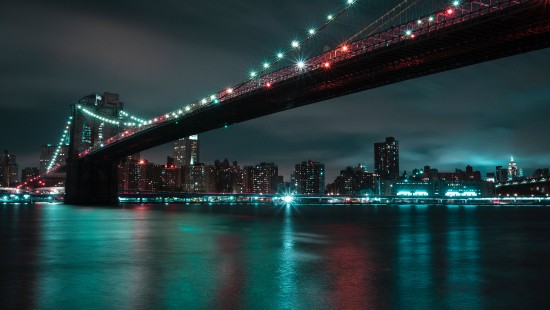 Image bridge over water during night time