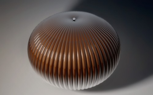 Image brown round ceiling lamp turned on in a room