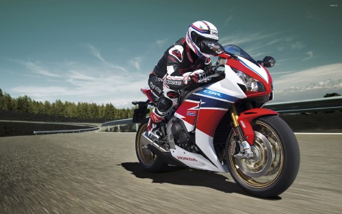 Image man riding on red and white sports bike