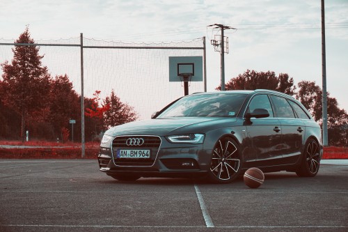 Image black audi sedan parked on gray concrete road during daytime