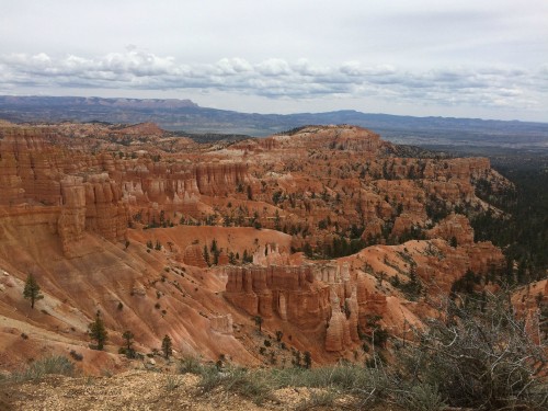 Image brown rock formation under white clouds during daytime