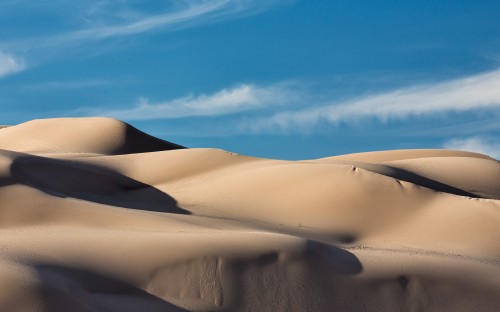 Image white sand under blue sky during daytime