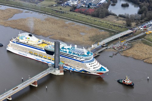 Image white and blue cruise ship on water during daytime