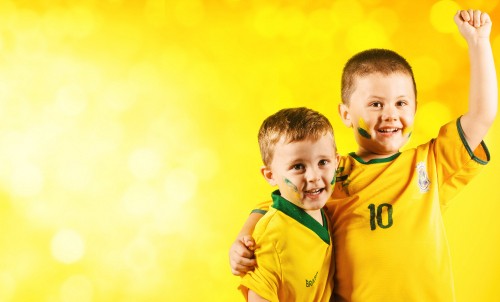 Image boy in yellow and green adidas jacket