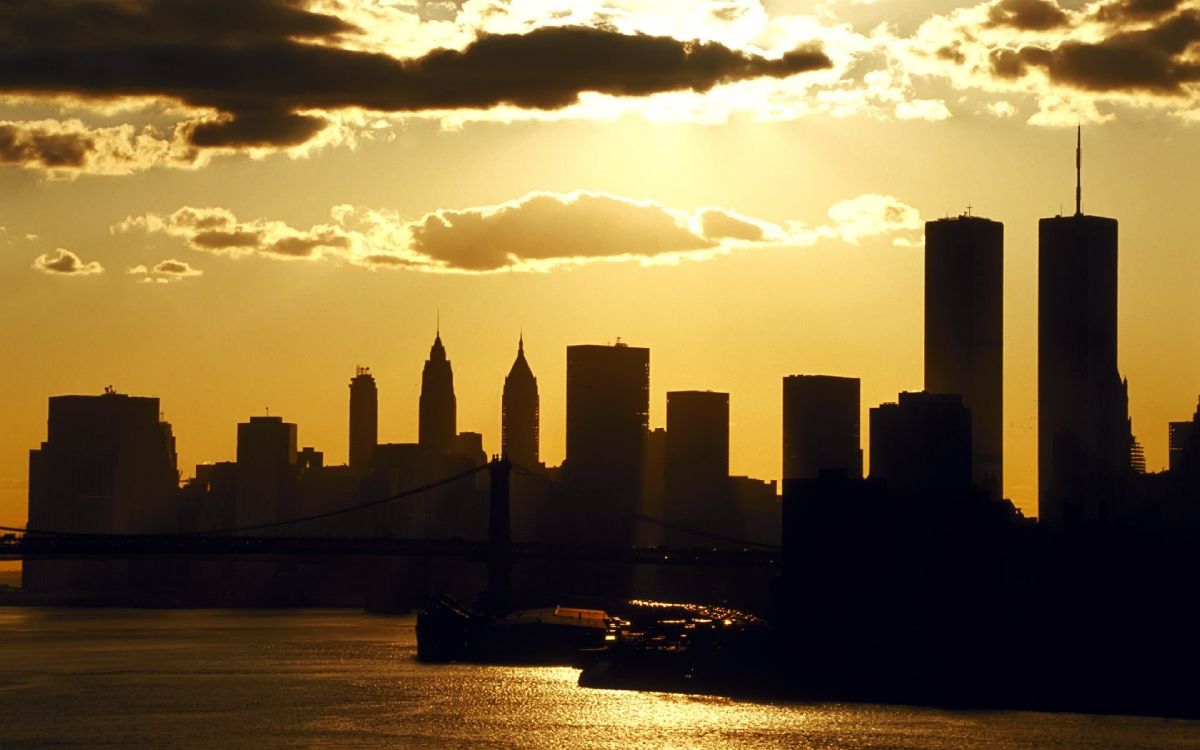 silhouette of city skyline during sunset