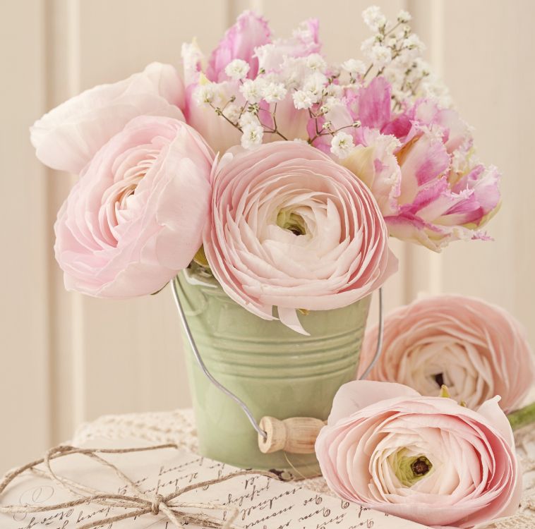 pink roses in green ceramic vase