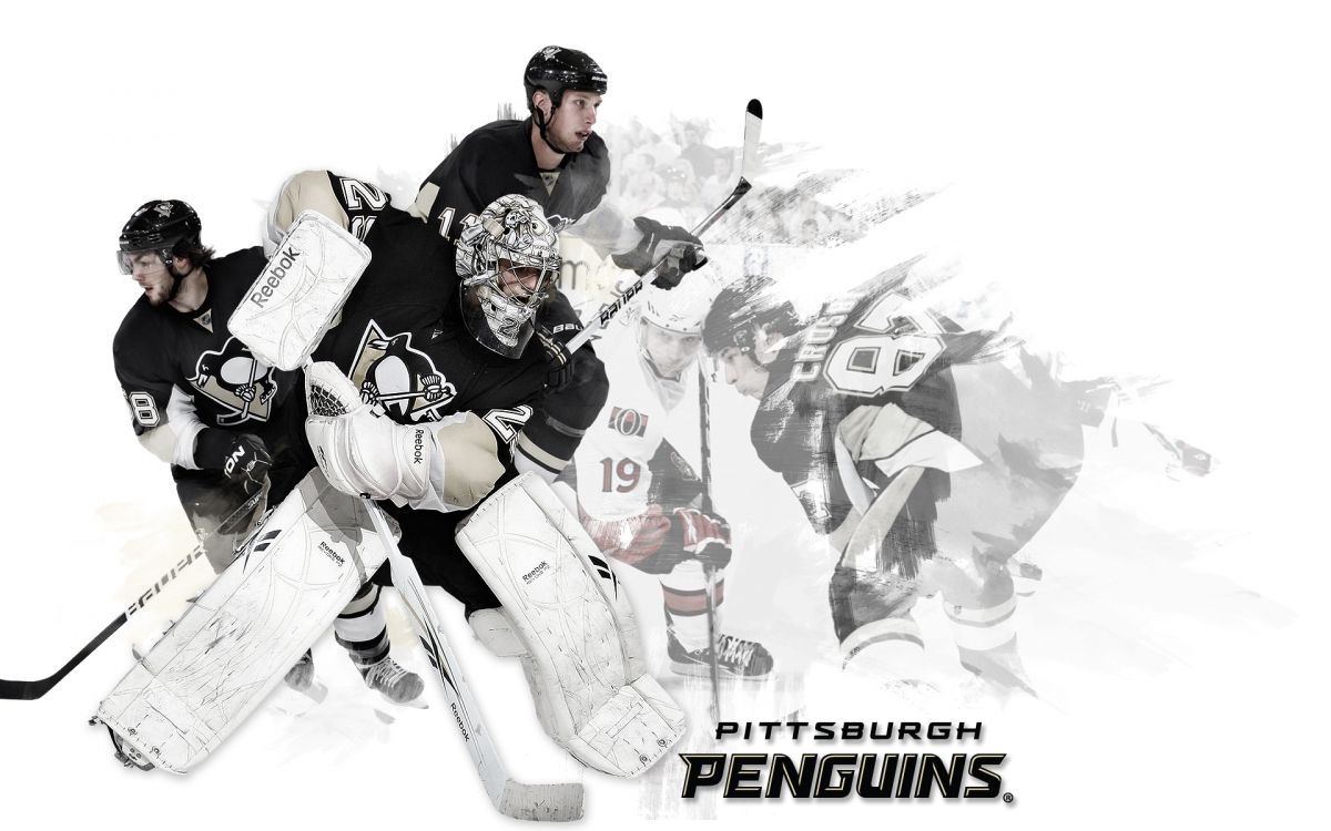 man in black and white jersey shirt holding white and red ice hockey stick