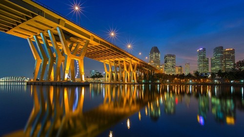 Image white bridge over water during night time