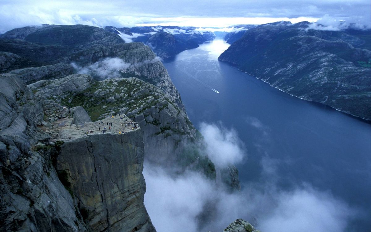 aerial view of green mountains and white clouds