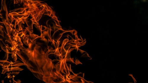 Image orange fire in black background