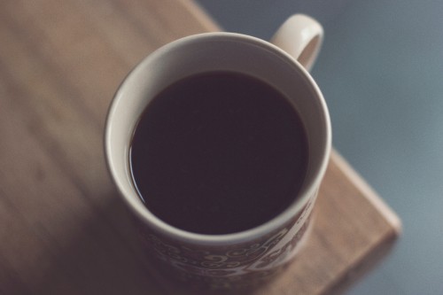 Image white ceramic mug on brown wooden table