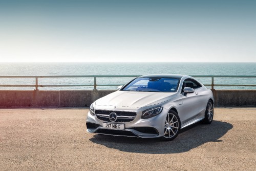 Image silver mercedes benz coupe parked on brown sand near sea during daytime