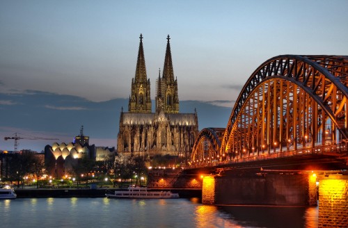 Image brown concrete bridge over river during night time