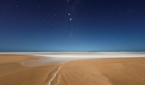 Image brown sand under blue sky during daytime