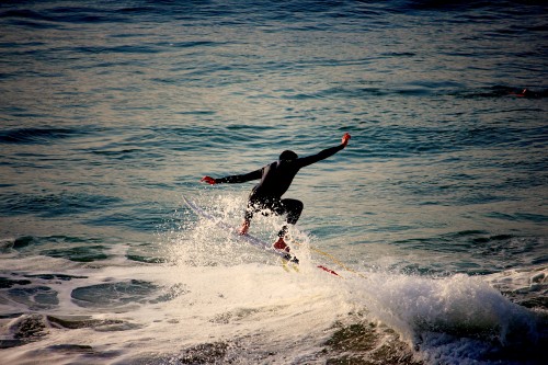 Image man surfing on sea waves during daytime