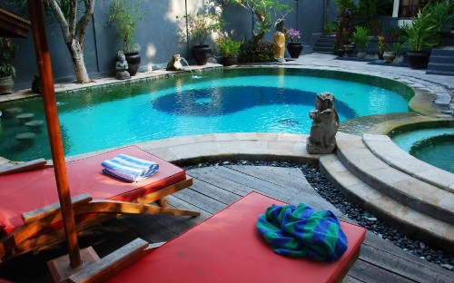 Image blue textile on red and blue mat near swimming pool