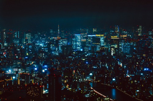 Image city with high rise buildings during night time