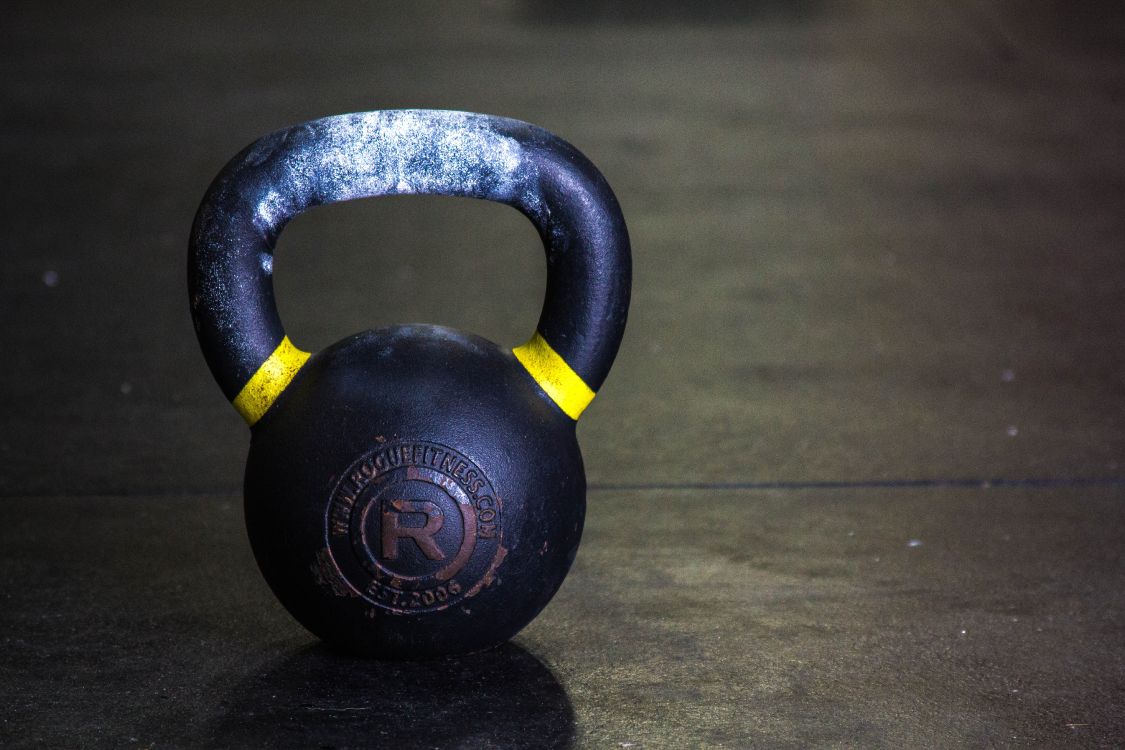 Black Kettle Bell on Brown Wooden Table. Wallpaper in 5184x3456 Resolution