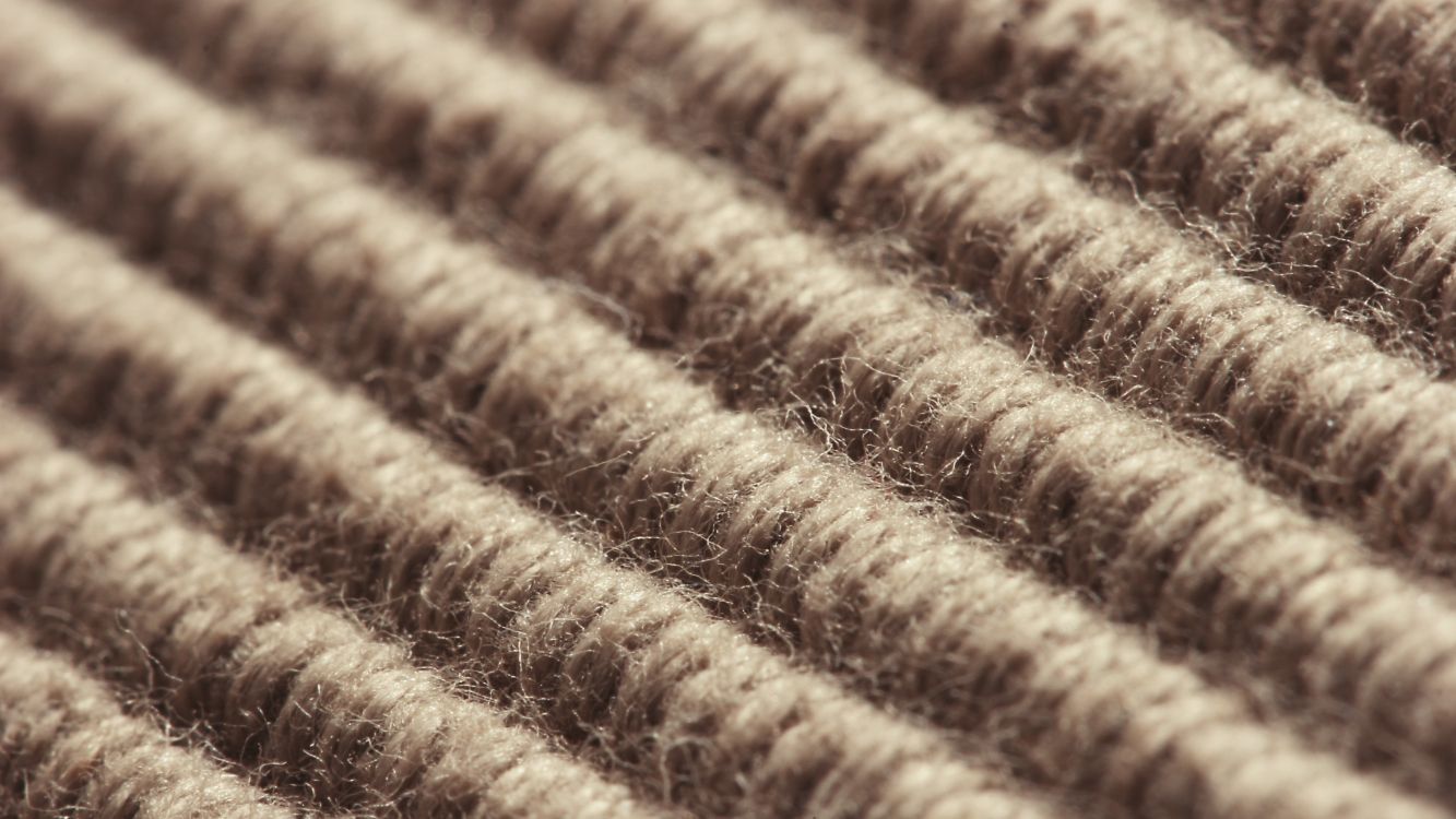 brown and white striped textile