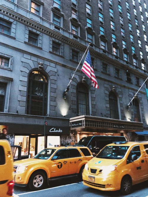 Image yellow taxi cab on road near building during daytime