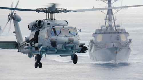 Image gray helicopter on snow covered ground during daytime