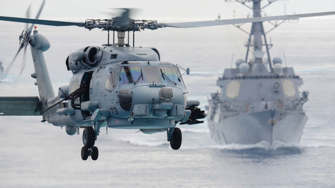 gray helicopter on snow covered ground during daytime