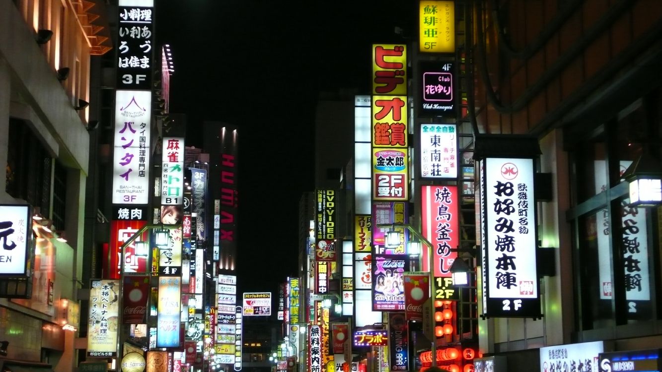 city buildings with lights during night time