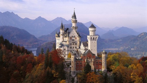 Image white and brown concrete castle on mountain