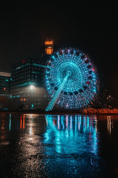 Blaues Und Weißes Riesenrad Während Der Nacht. Wallpaper in 4000x6000 Resolution