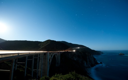 Image white wooden bridge over blue sea during daytime