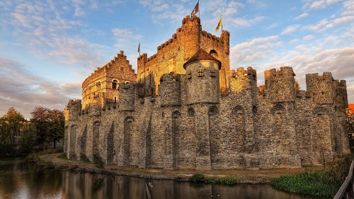 Image brown concrete castle on water