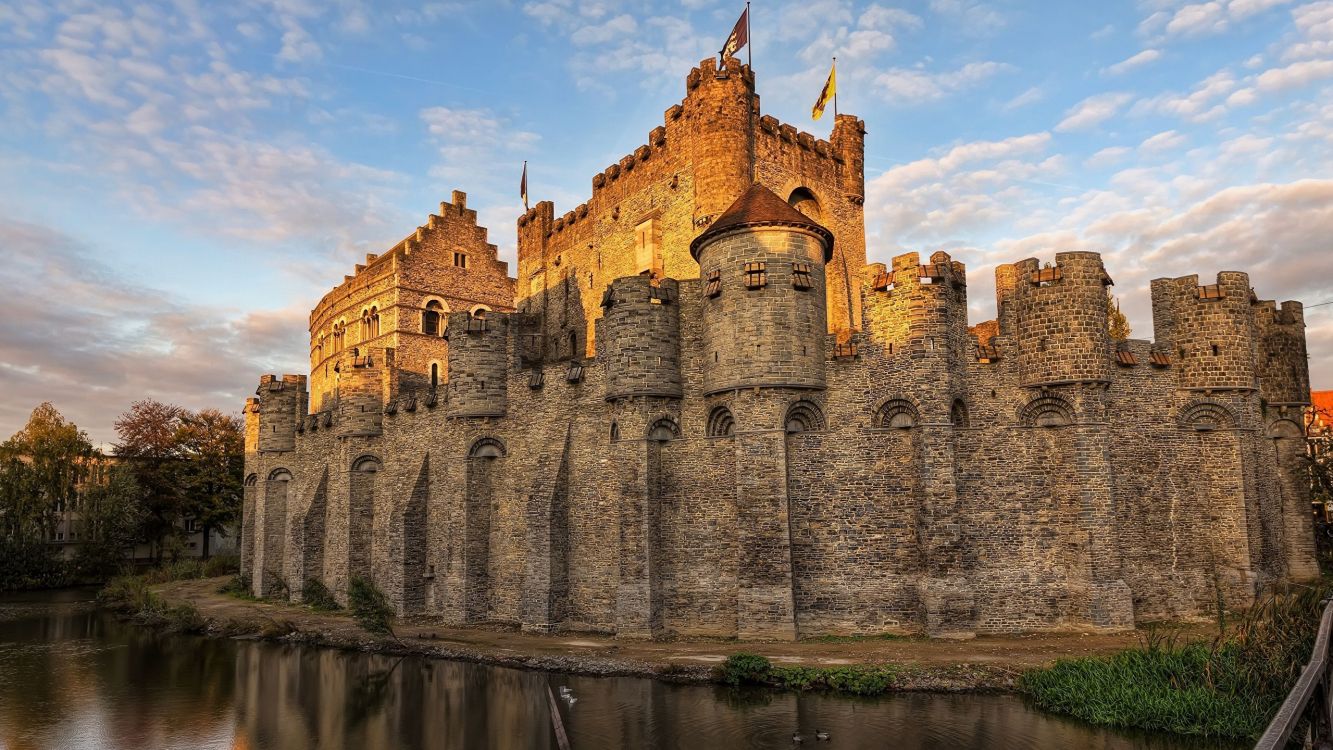 brown concrete castle on water