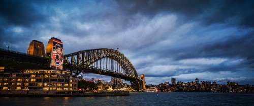 Image bridge over body of water during night time