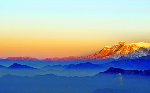 Image brown mountains under blue sky during daytime