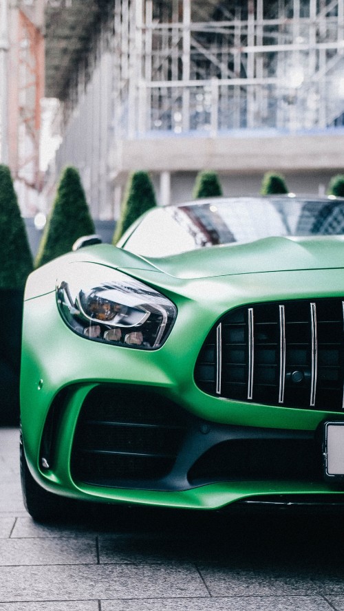 Image green car with white and black car on the side