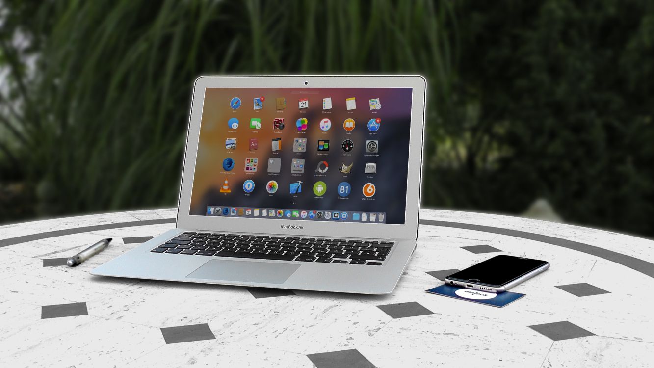 macbook air on white table