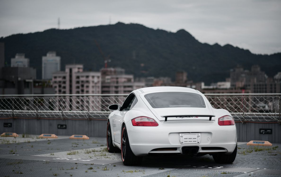 white porsche 911 on road during daytime