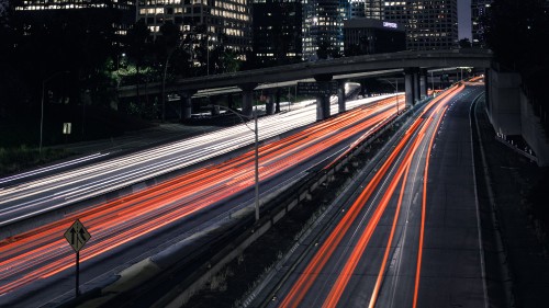 Image time lapse photography of cars on road during night time