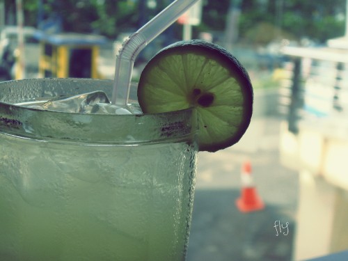 Image clear drinking glass with ice and straw