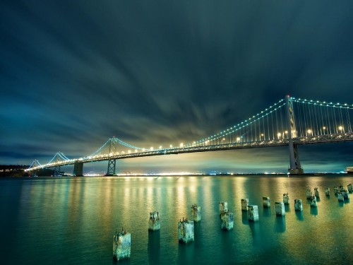 Image bridge over water during night time