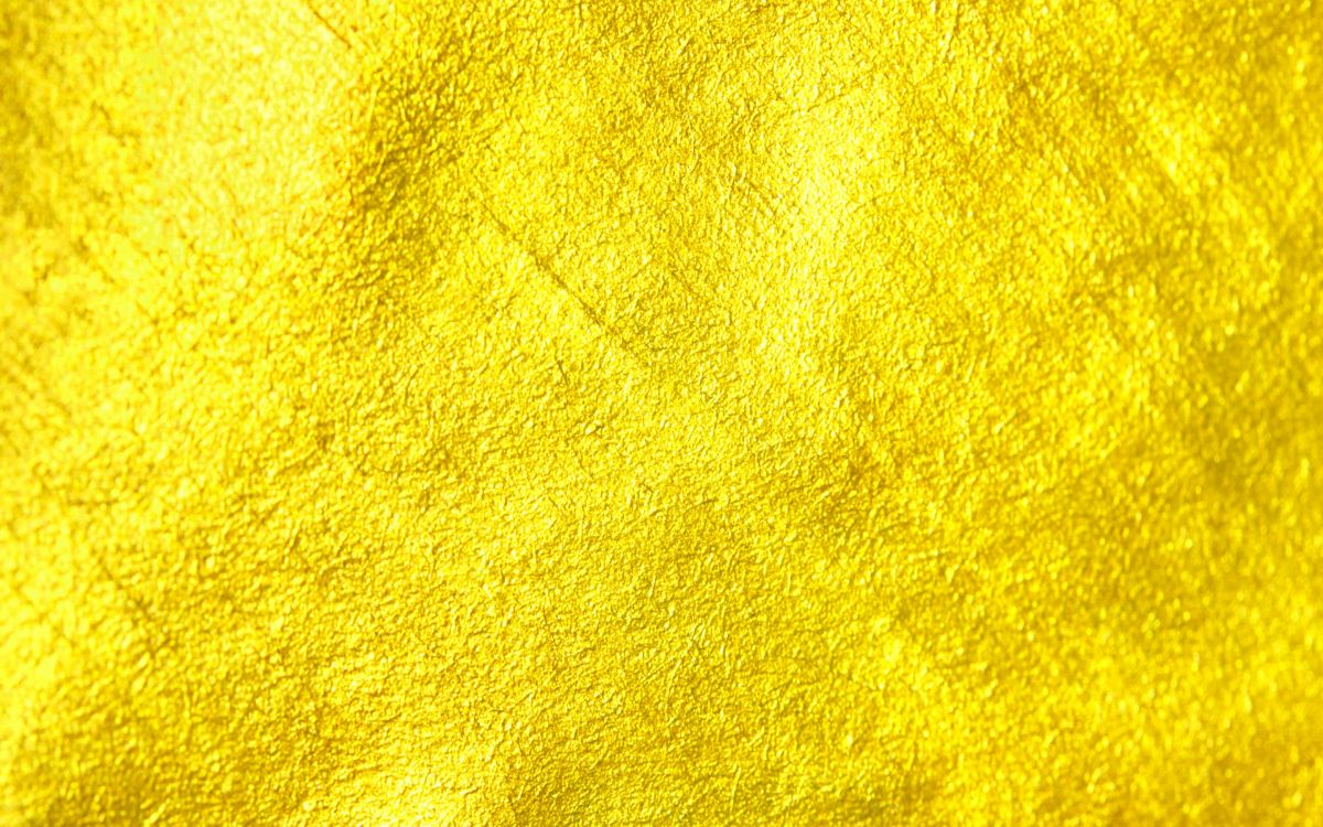 yellow textile on brown wooden table