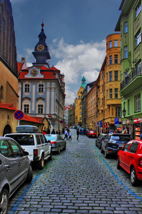 Image cars parked on street near buildings during daytime