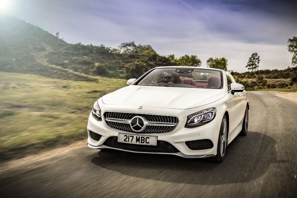 white mercedes benz convertible coupe on road during daytime