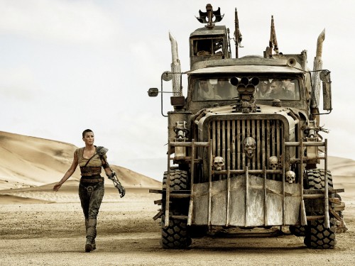 Image grayscale photo of man and woman standing beside truck