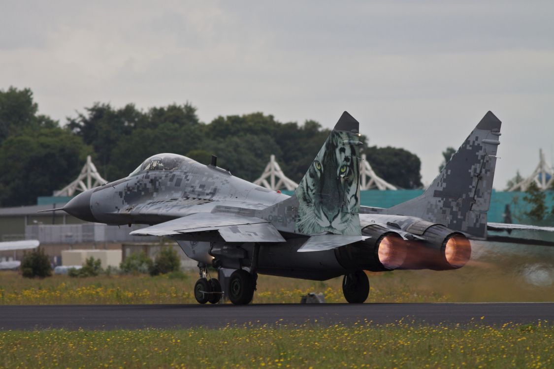 person holding black fighter jet