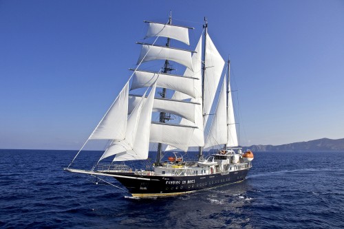 Image white and black sail boat on sea during daytime