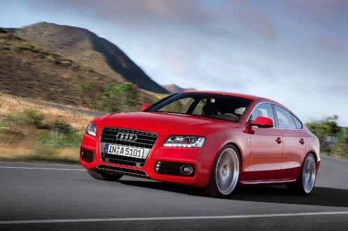 Image red audi coupe on road during daytime