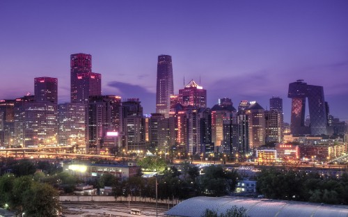 Image city buildings with lights turned on during night time